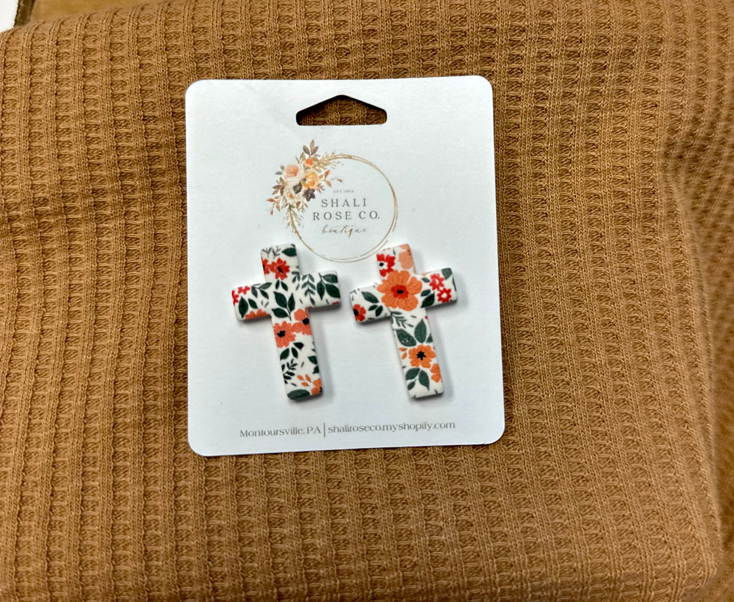 Floral cross clay studs